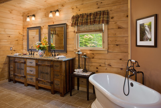 Interior, horizontal, master bathroom toward tub and vanity, Rosenfeld residence, Franconia, New Hampshire; Coventry Log Homes