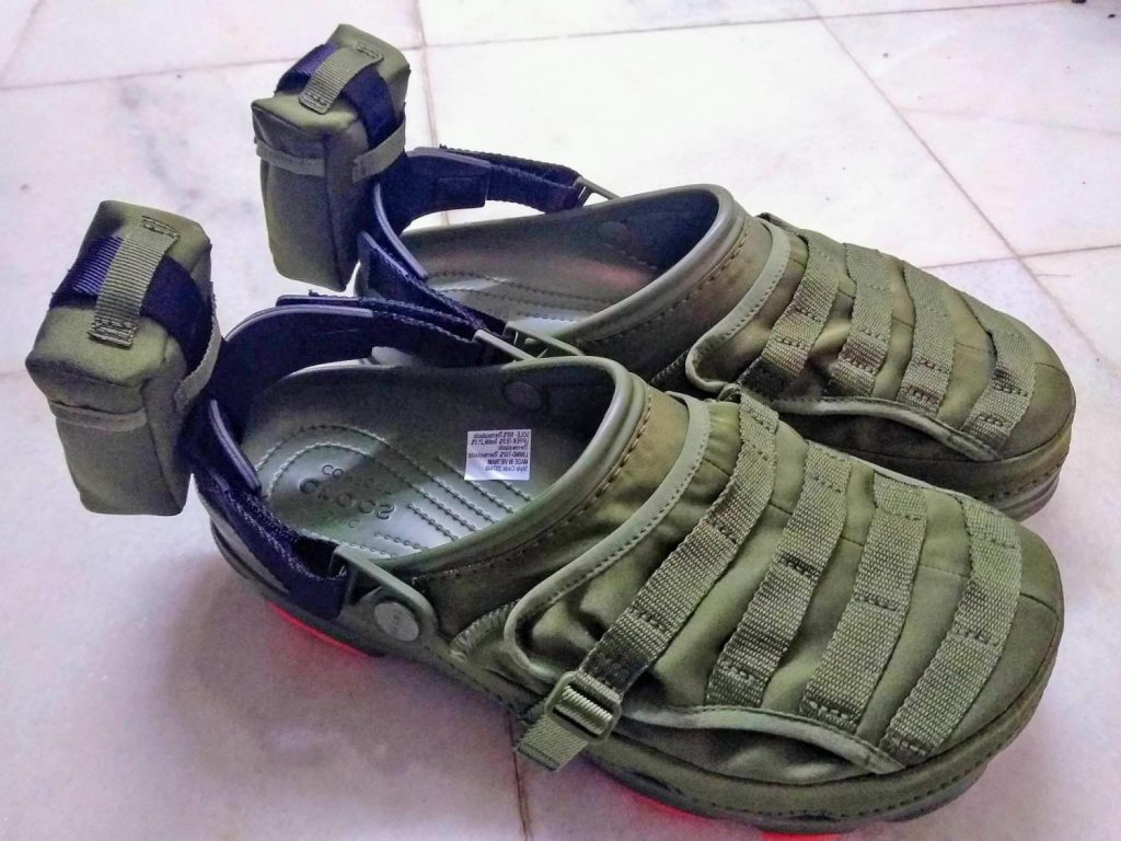 These military-styled Crocs are fitted with MOLLE Straps and a Storage ...