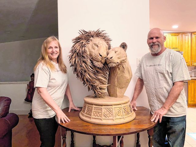 Artists created a cardboard sculpture of two lions in love Home